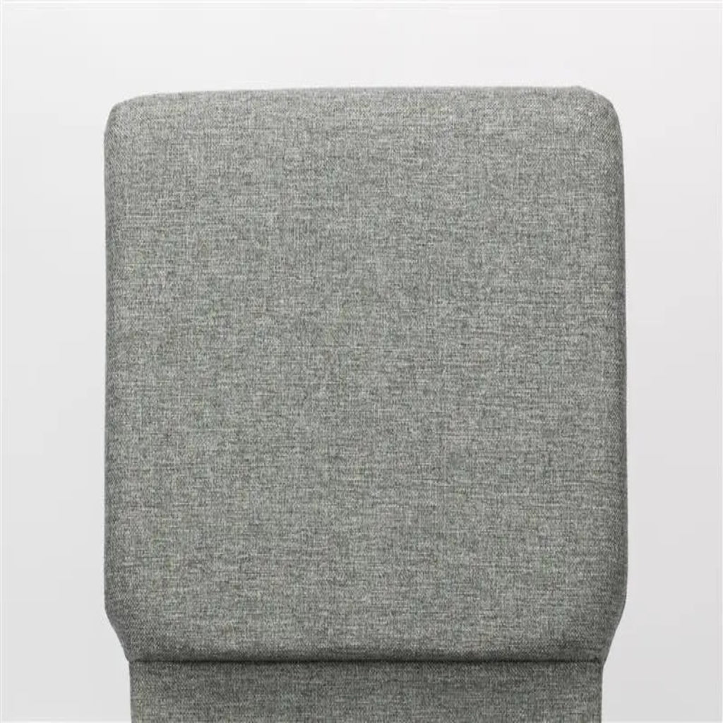 Gray upholstered chair backrest on a white background