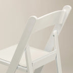 Silla plegable de resina blanca TitanPRO™ 100 unidades